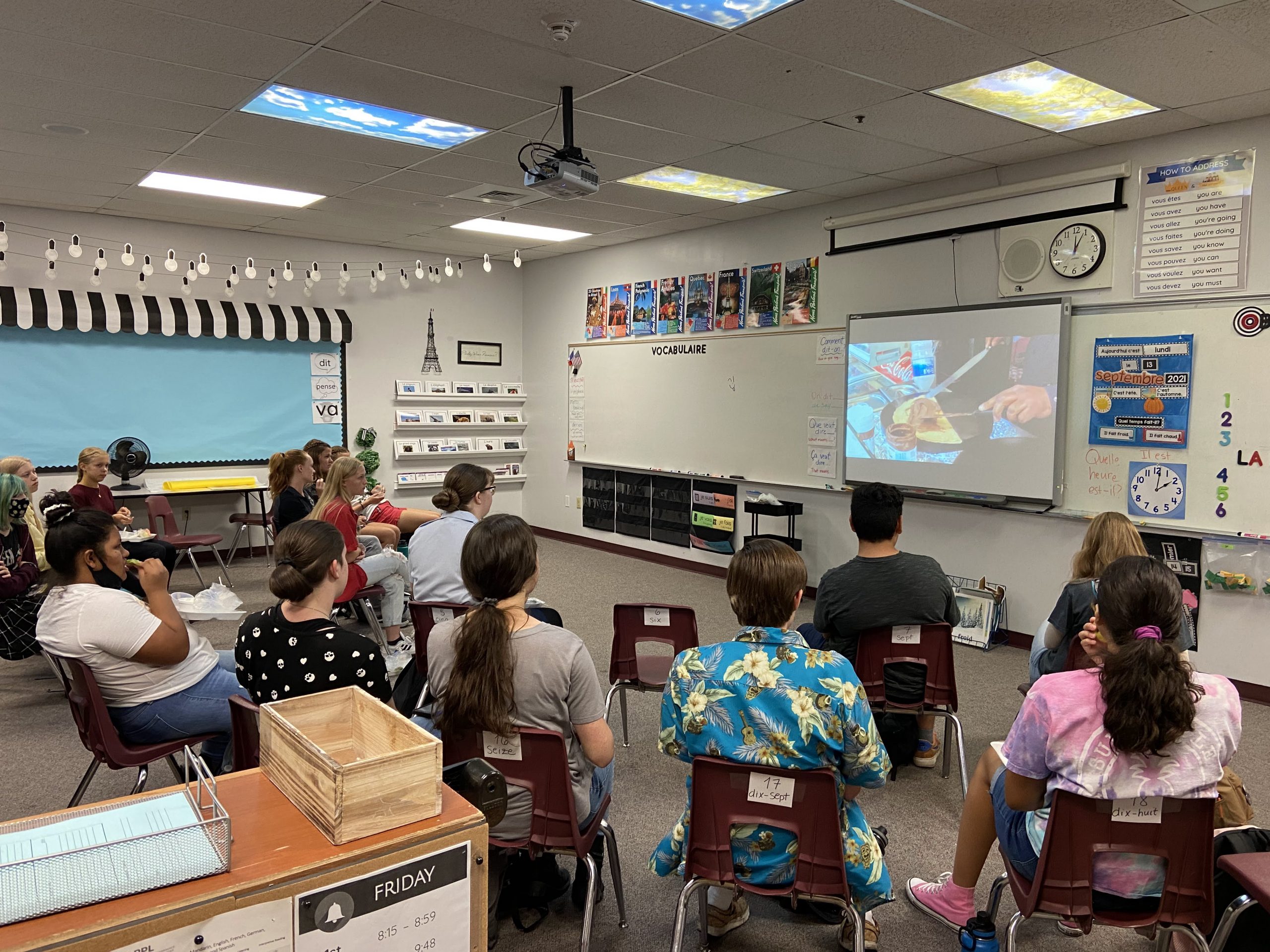 Students watching video of French food