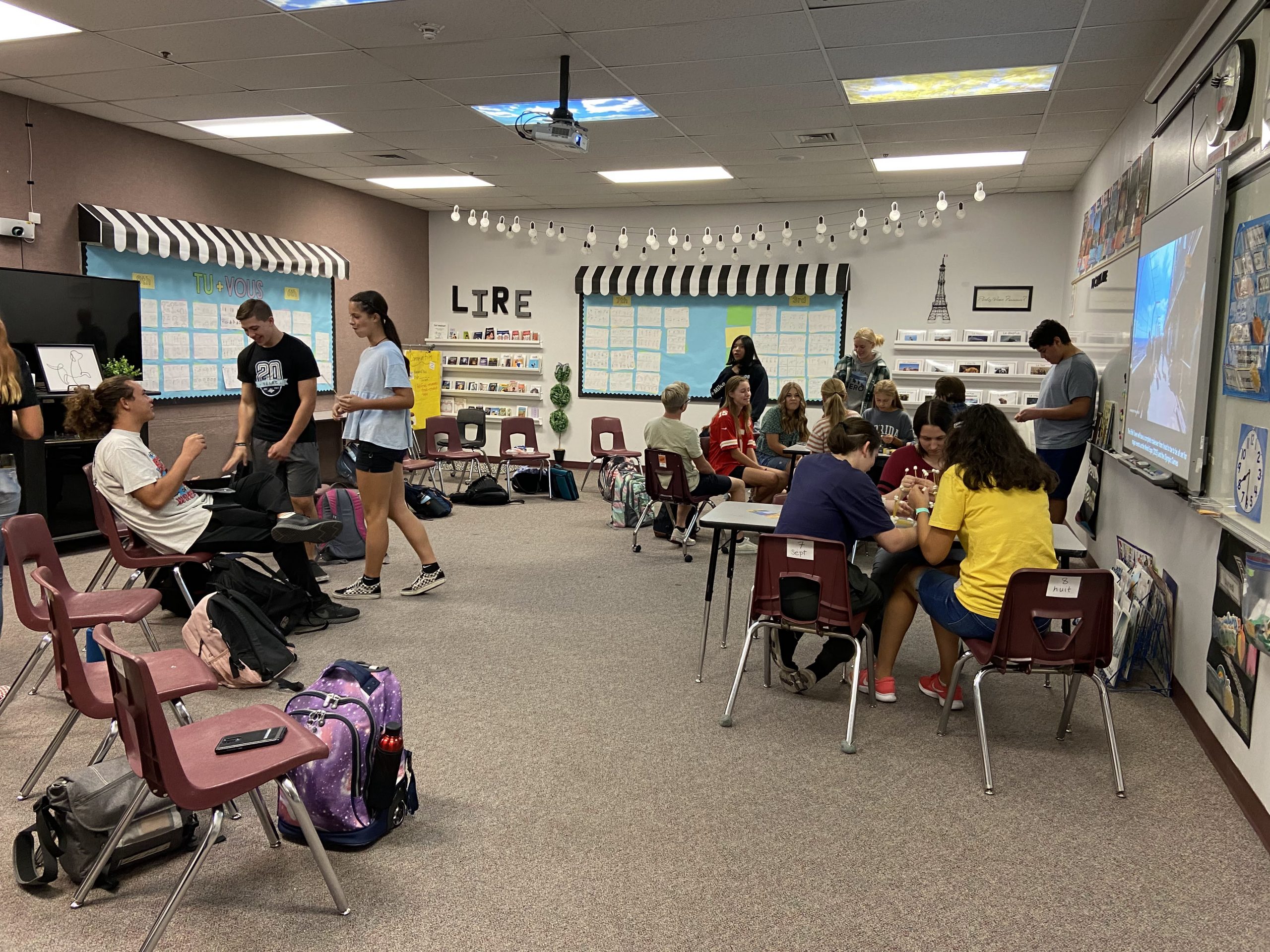 Students walking around French class