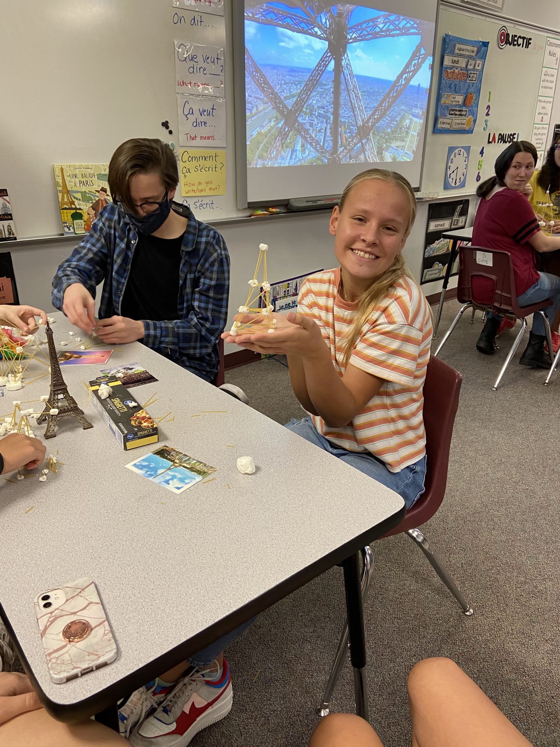 Student showing off Eiffel Tower she made