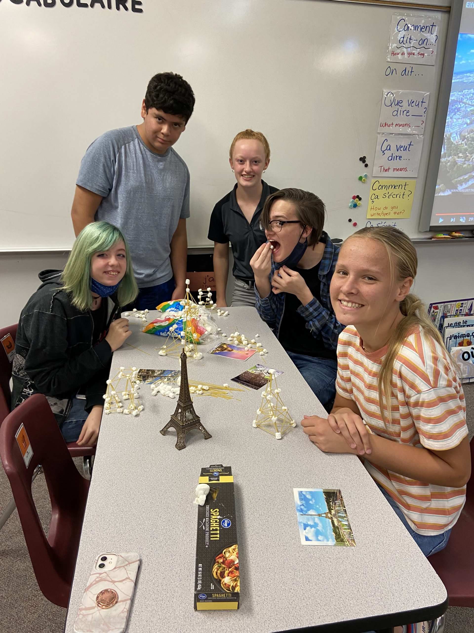 students making Eiffel tower with toothpicks and marshmellows